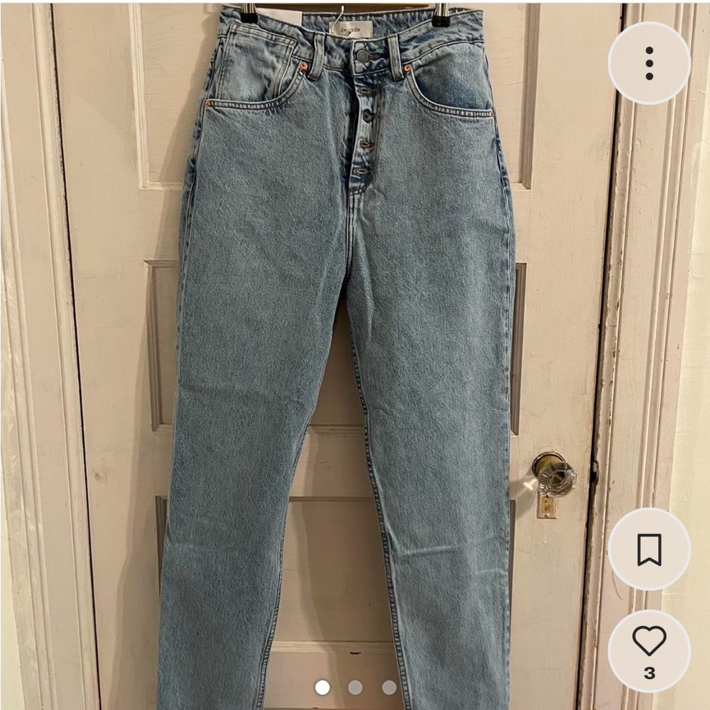 Light wash button fly jeans